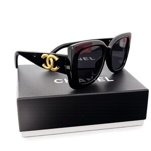 CHANEL Women's Sunglasses in Black with Gold Logo